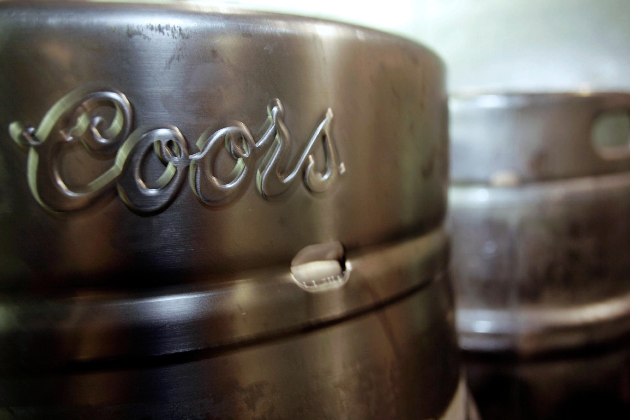 Barrels of Coors beer stand at Coors Field in Denver. Miller Coors' sustainability report, shows the brewer has cut down its water use to 3.48 barrels of water per barrel of beer a 9.2 percent drop from 2012. That's roughly 1 billion barrels of water