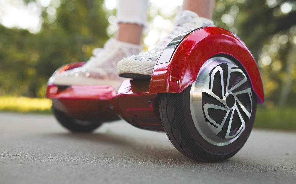 Girl feet on the hover board.