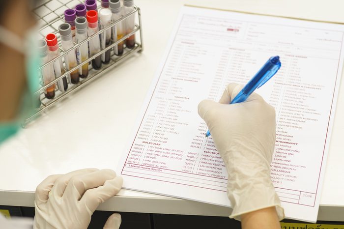 scientist record result of blood inspection in report form