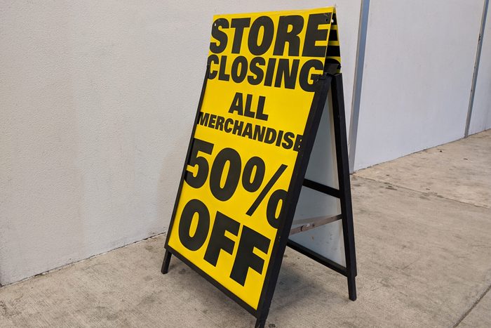 Store Closing 50% Off sign outside of a liquidated business
