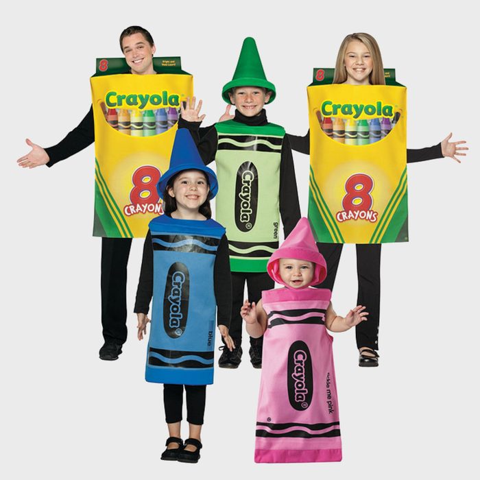 People wear colorful crayon costumes, smiling and posing together. Each costume represents a different crayon color, including green, blue, and pink.