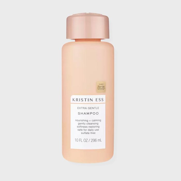 A peach shampoo bottle labeled 