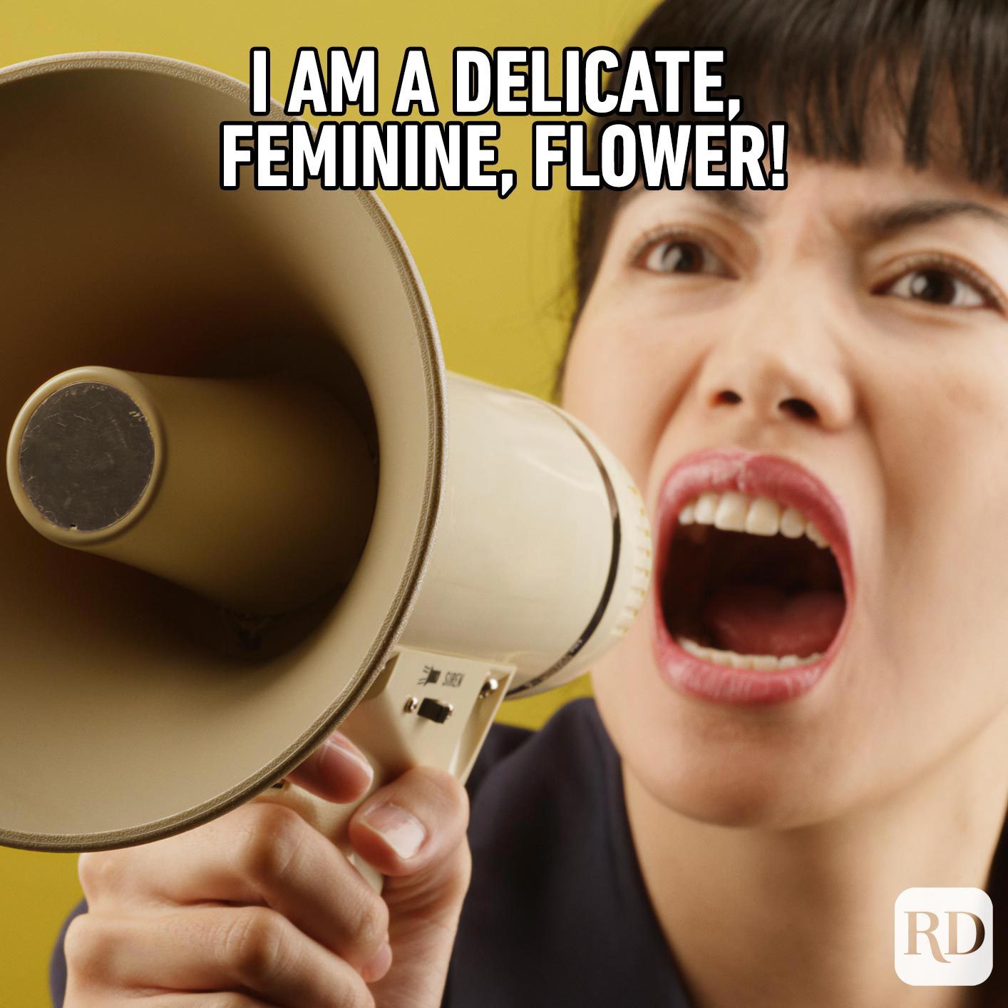 Woman shouting into megaphone with aggression. Meme text: I am a delicate, feminine, flower!