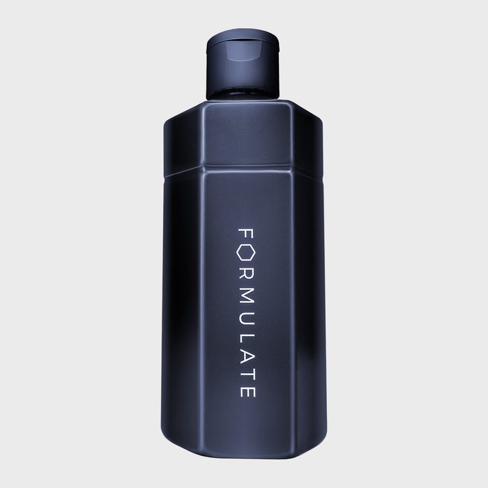 Bottle stands upright, displaying the word 