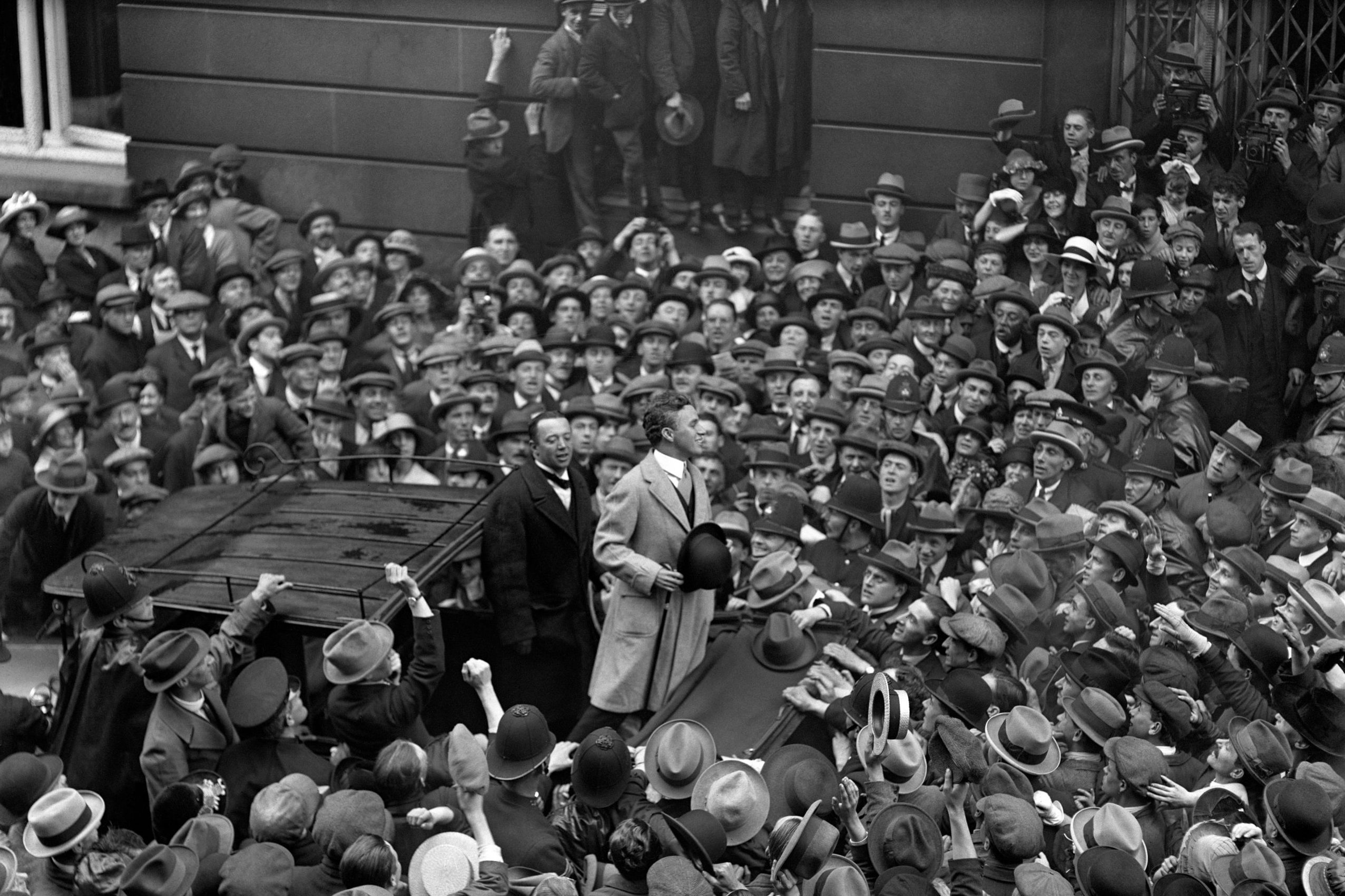 Charlie Chaplin, addressing the crowd outside the Ritz Hote