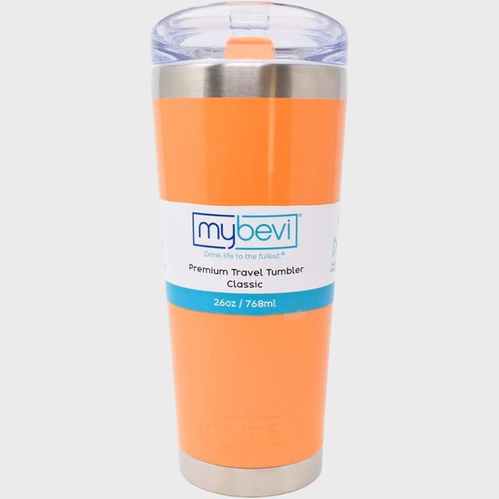 Orange travel tumbler stands on a gray background, labeled 