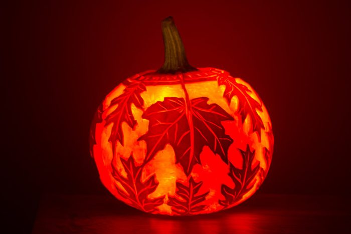 fall leaves carved into pumpkins