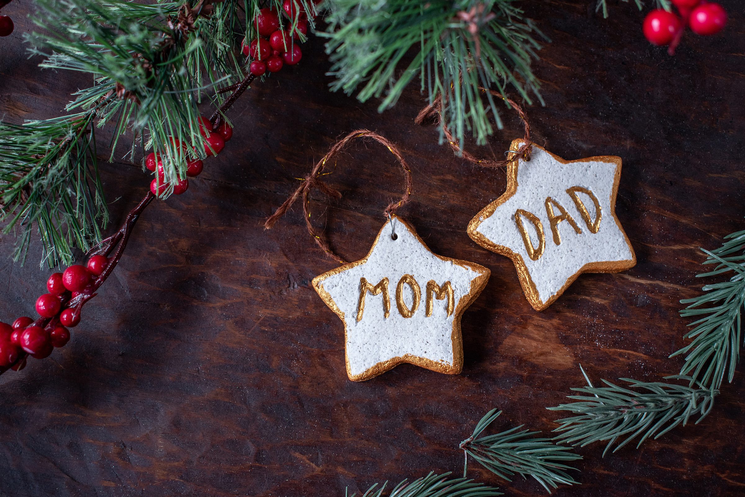 hand painted Christmas star ornaments for mom and dad on festive tree
