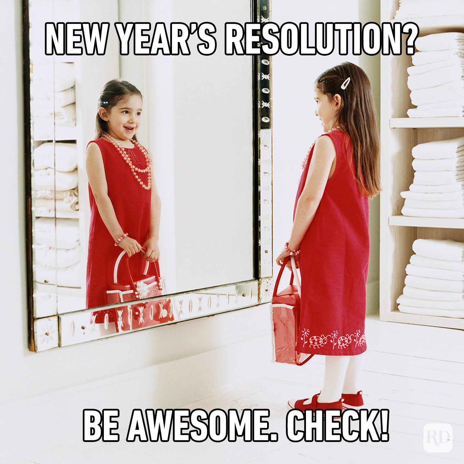 Young, Smiling Girl Looking At Her Reflection In The Mirror