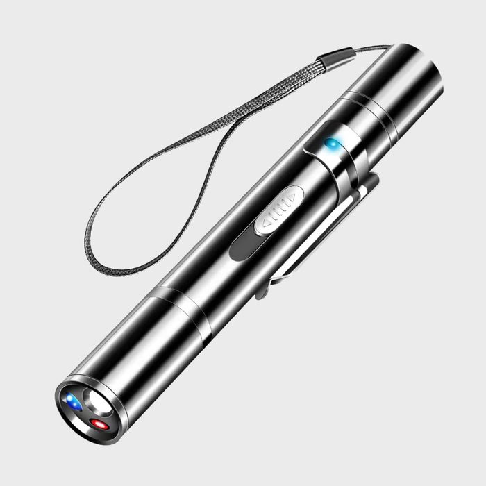 Metallic flashlight displays blue and red lights; features a wrist strap, clip, and buttons. Set against a plain background.