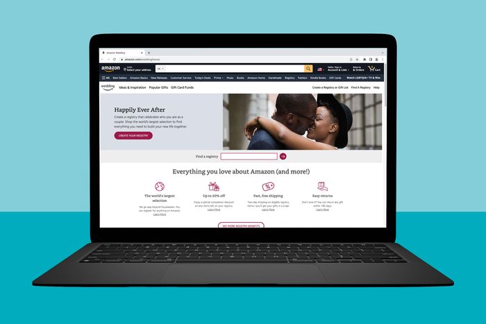 A laptop displays Amazon Wedding Registry page, featuring a couple embracing, with options for creating a registry and browsing wedding-related benefits.