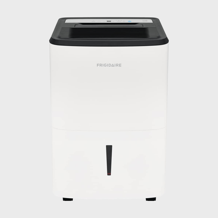 A white dehumidifier sits idle on a plain background, featuring black vents on top and the brand 