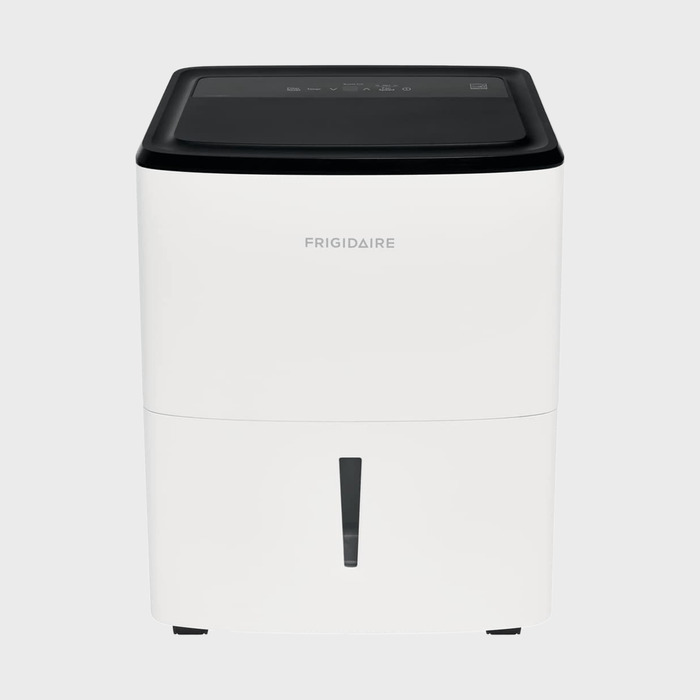 White dehumidifier stands on a flat surface; brand 