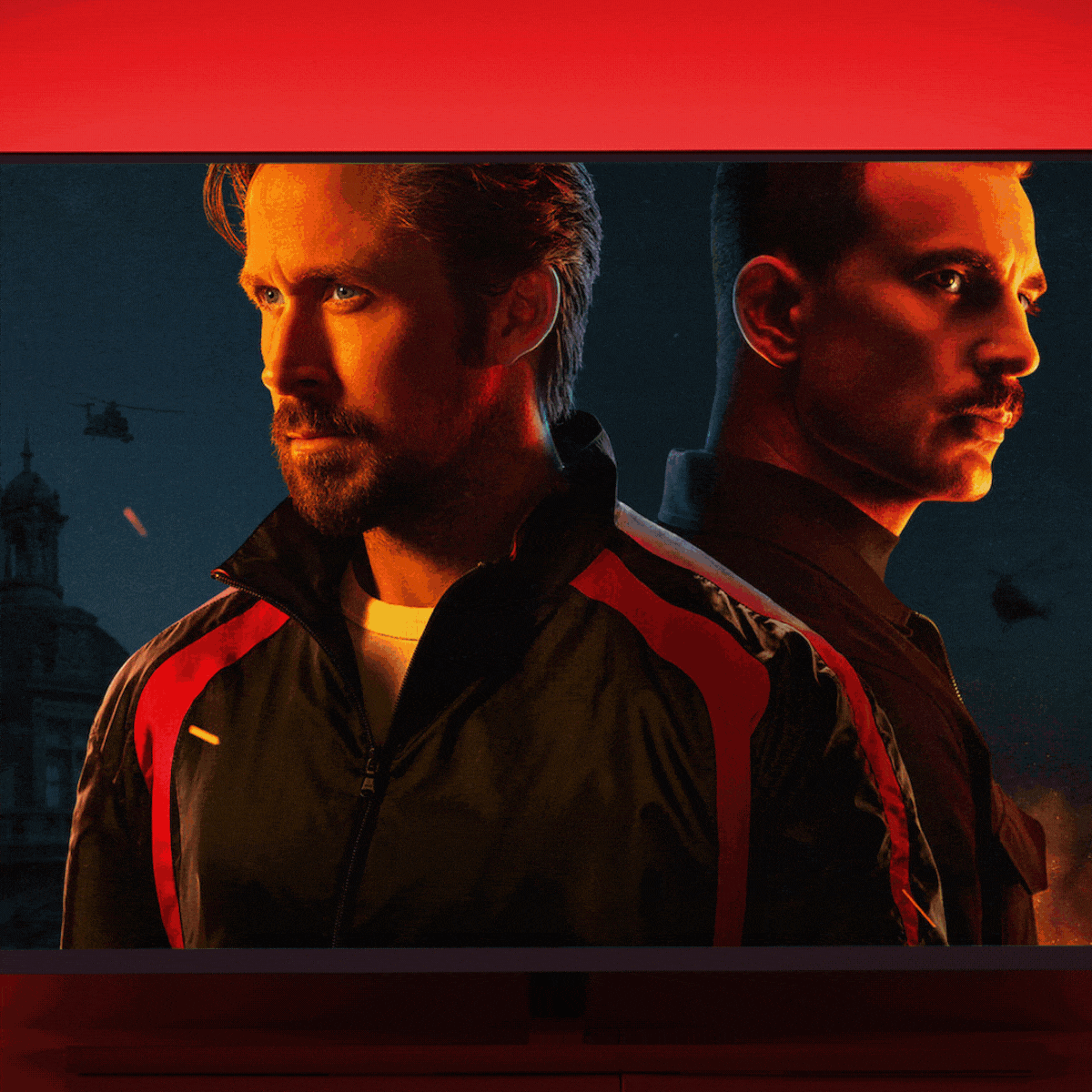 Two men stand back-to-back, gazing into the distance; helicopters and cityscape visible under a vivid red sky.