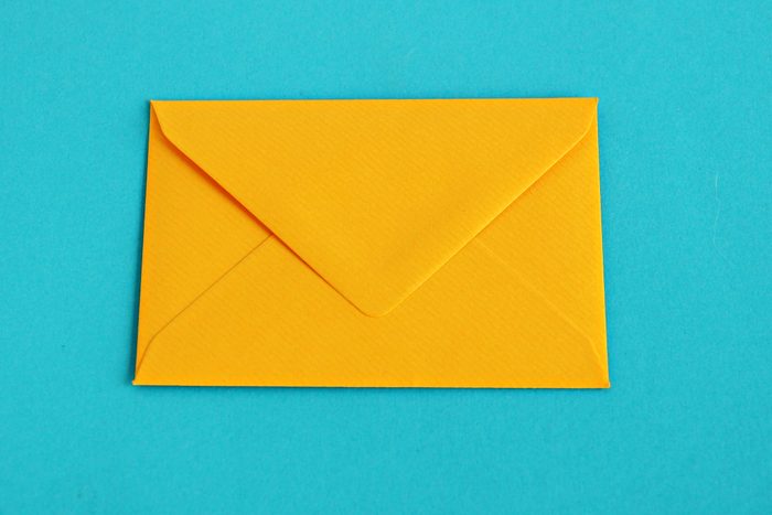 Yellow envelope over turquoise background