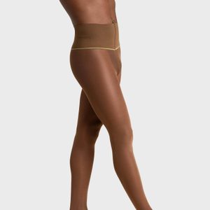 Sheer brown pantyhose is modeled, highlighting its fit and texture against a plain gray background.