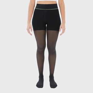 Person stands wearing opaque-to-sheer black tights, in a neutral studio setting.