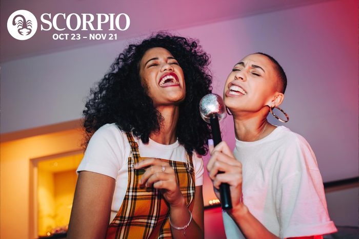 two friends signing karaoke together
