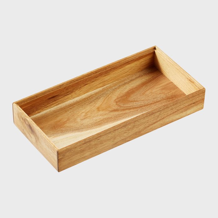 A rectangular wooden tray rests on a plain white background, displaying its smooth, natural grain and simple, elegant construction.