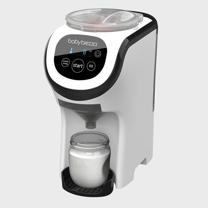 Machine dispenses liquid into a glass jar; digital control panel labeled 