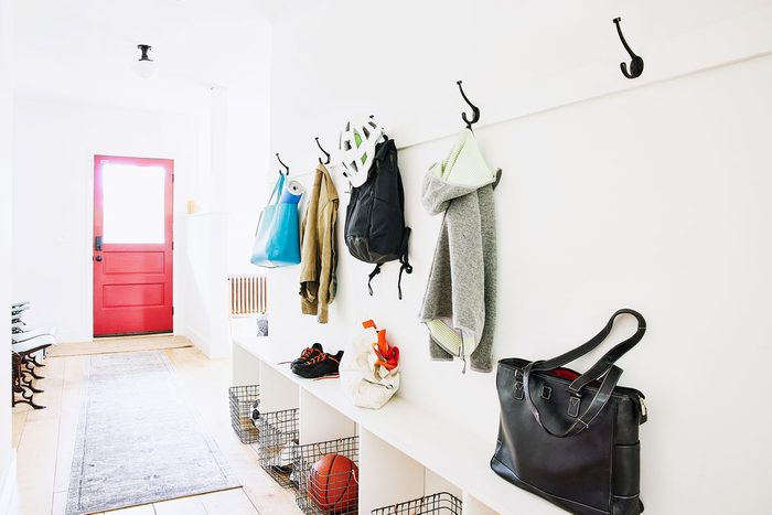 Wide Shot Of Coats Bags And Shoes In Entryway Of Home